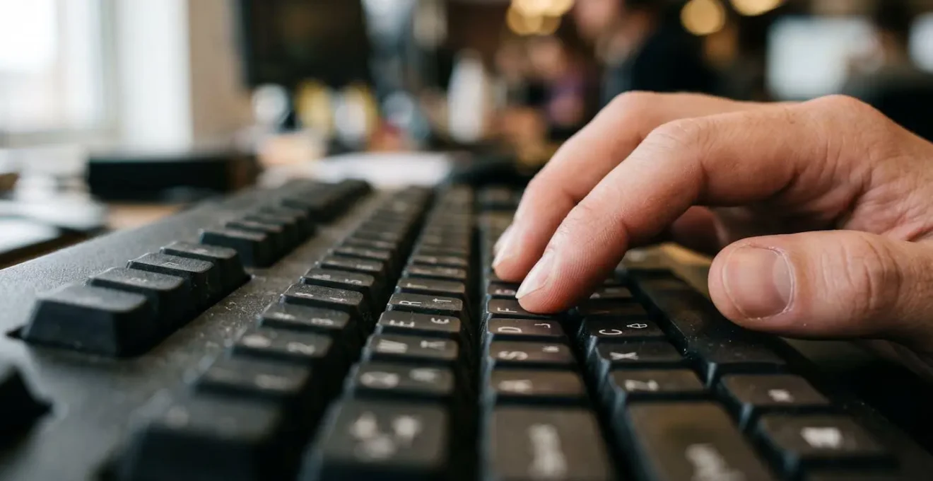 Close-up view of hands optimizing meta descriptions in a CMS interface